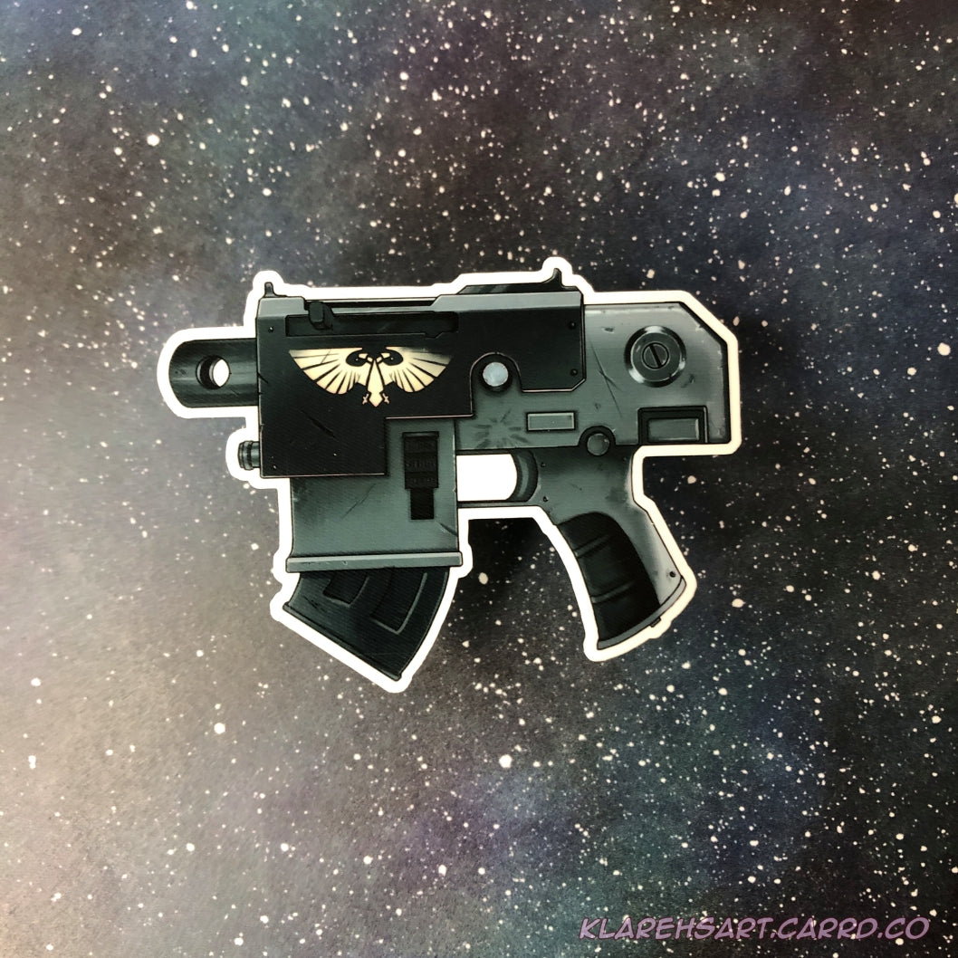 A black and green gray bolt gun pistol sticker with a futuristic theme. Roman double headed eagle adorns the side. Resting on a starry background.